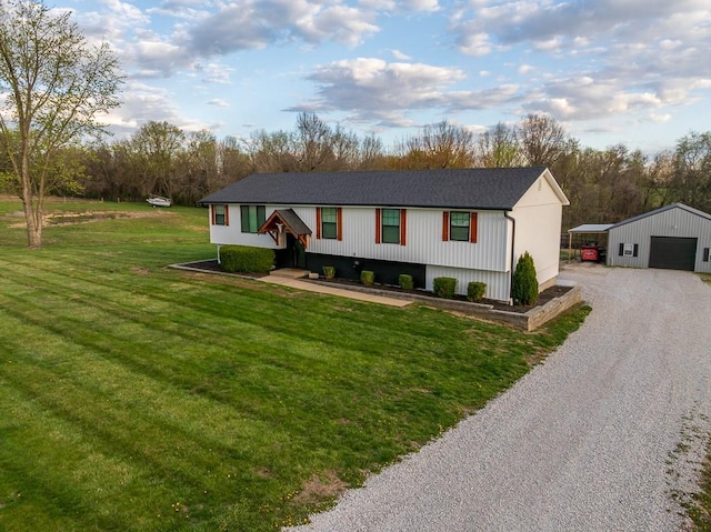 20609 NE 161st St, Kearney, MO 64060 - split foyer home featuring a detached garage, an outbuilding, a front lawn, and gravel driveway