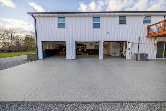 20609 NE 161st St, Kearney, MO 64060 - rear view of house featuring an attached garage, cooling unit, and driveway