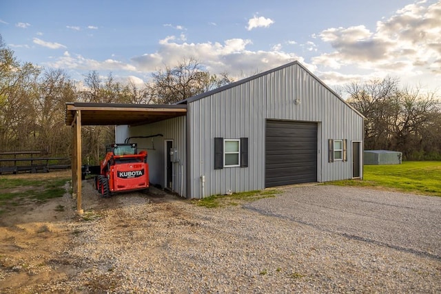 20609 NE 161st St, Kearney, MO 64060 - garage with a garage, fence, and gravel driveway