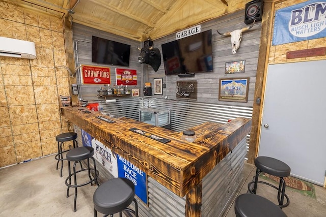 20609 NE 161st St, Kearney, MO 64060 - bar featuring wood walls, concrete flooring, and a wall mounted air conditioner