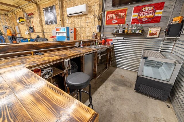 20609 NE 161st St, Kearney, MO 64060 - bar with wood walls, a workshop area, and unfinished concrete floors