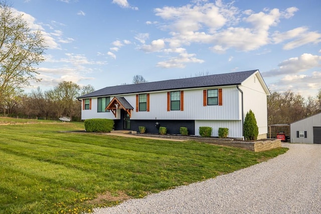 20609 NE 161st St, Kearney, MO 64060 - bi-level home with a detached garage, a front yard, and gravel driveway