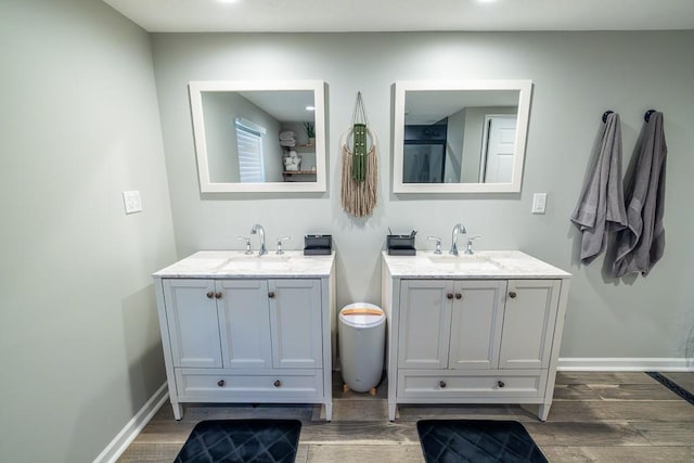 20609 NE 161st St, Kearney, MO 64060 - full bathroom with wood finished floors, a sink, and two vanities