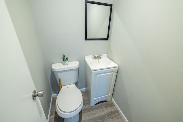 20609 NE 161st St, Kearney, MO 64060 - bathroom featuring vanity, baseboards, wood finished floors, and toilet
