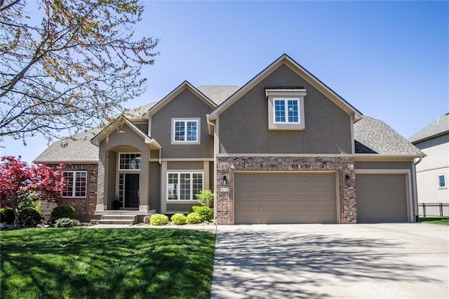 craftsman-style home featuring a front yard, a garage, brick siding, concrete driveway, and stucco siding
