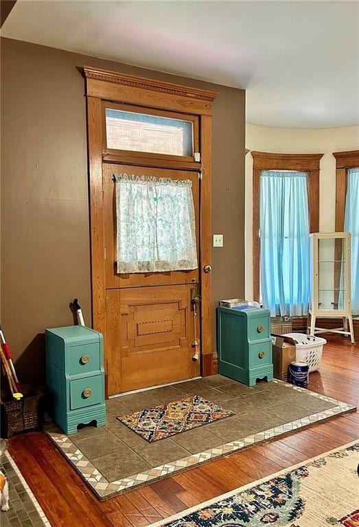 foyer featuring wood finished floors