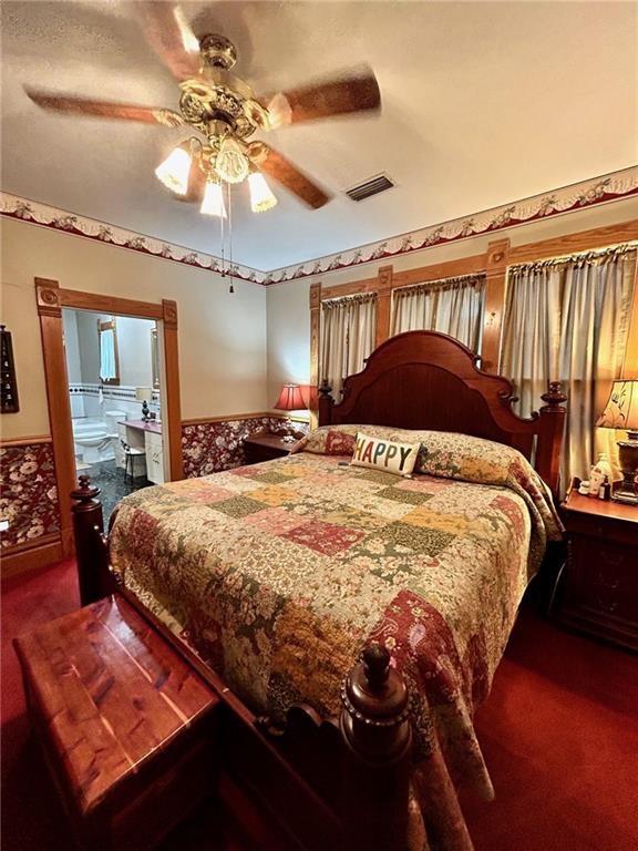 bedroom with carpet and a ceiling fan