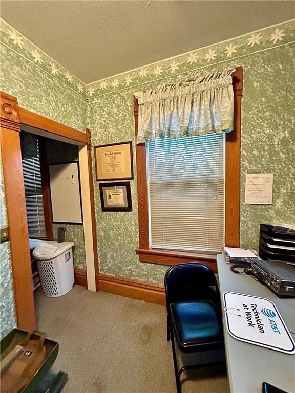 bathroom featuring wallpapered walls