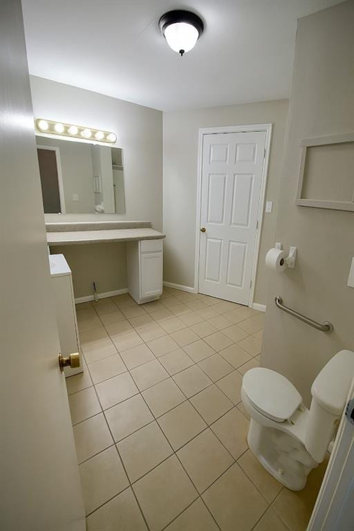 5610 Euclid Ave, Kansas City, MO 64130 - half bathroom featuring toilet and tile patterned floors