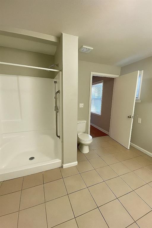 5610 Euclid Ave, Kansas City, MO 64130 - full bath with tile patterned floors and a shower stall