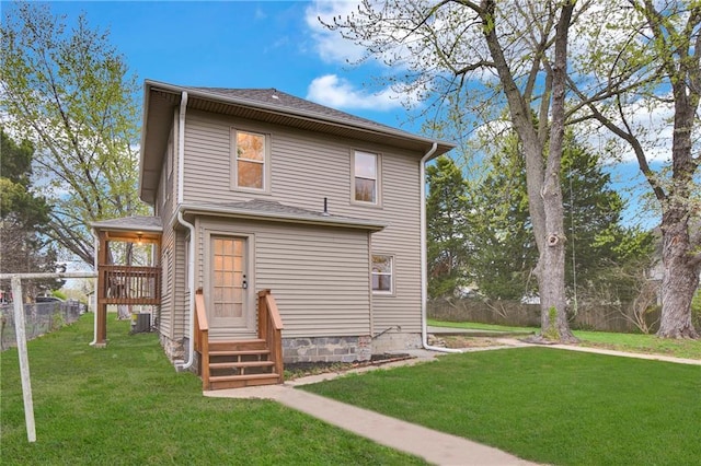 1610 S Northern Blvd, Independence, MO 64052 - back of property with a yard, central AC unit, and fence