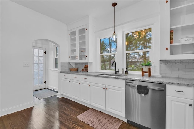 1610 S Northern Blvd, Independence, MO 64052 - kitchen with dishwasher, a healthy amount of sunlight, a sink, arched walkways, and light stone countertops