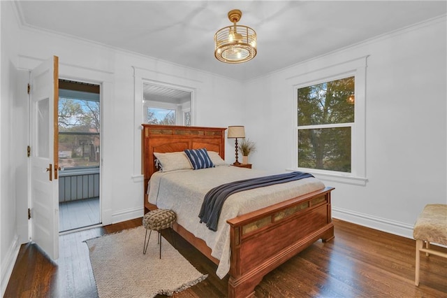1610 S Northern Blvd, Independence, MO 64052 - bedroom with baseboards, ornamental molding, a chandelier, and wood finished floors