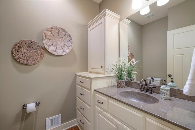 bathroom featuring visible vents and vanity