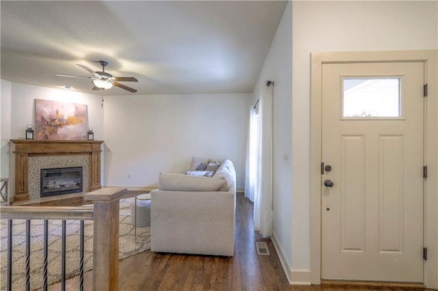 entryway featuring a healthy amount of sunlight, a ceiling fan, dark wood-style floors, and visible vents