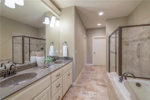 bathroom with a sink, a shower stall, and a bath