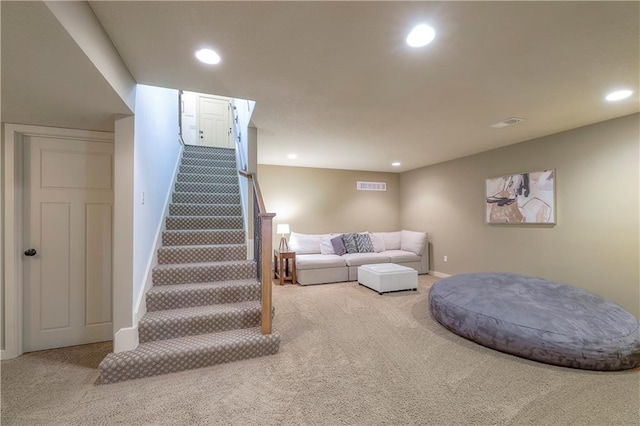 carpeted living area with stairway, baseboards, recessed lighting, and visible vents