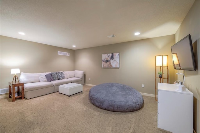 living room with light carpet, recessed lighting, and visible vents