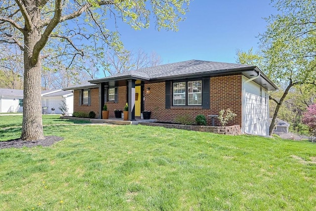 ranch-style house with brick siding, an attached garage, and a front yard