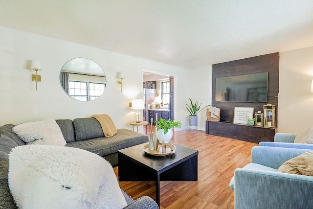 living room with healthy amount of natural light and wood finished floors