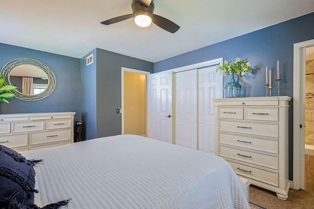 bedroom featuring carpet floors, a ceiling fan, and a closet