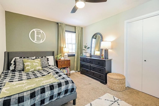 bedroom featuring carpet flooring, a closet, and ceiling fan