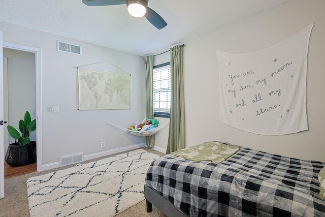 bedroom featuring a ceiling fan, carpet floors, and baseboards