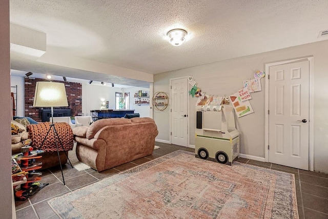 tiled living room with a textured ceiling