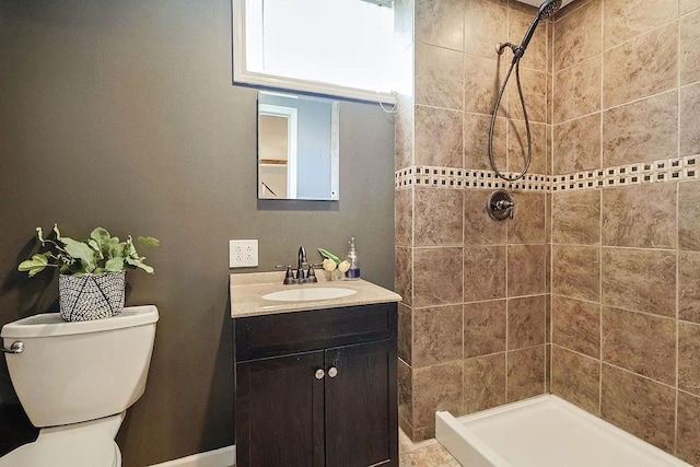 full bathroom with vanity, toilet, and a shower stall
