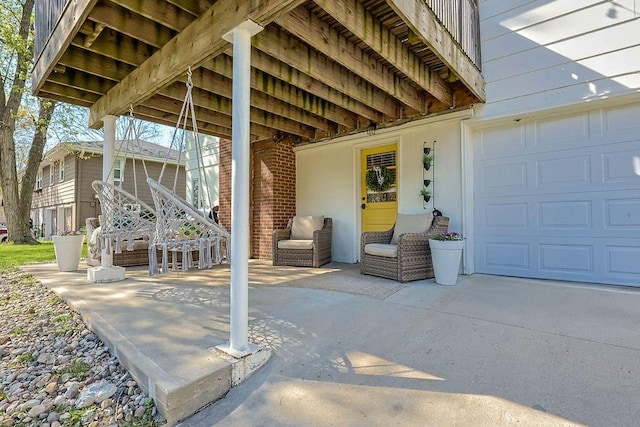 view of patio / terrace featuring concrete driveway