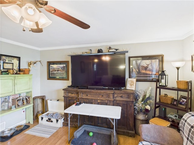 305 California Ave, Windsor, MO 65360 - living area with wood finished floors, crown molding, and a ceiling fan