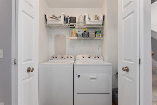 washroom featuring washer and dryer and laundry area