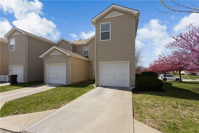 view of front of house with a front lawn, driveway, and an attached garage