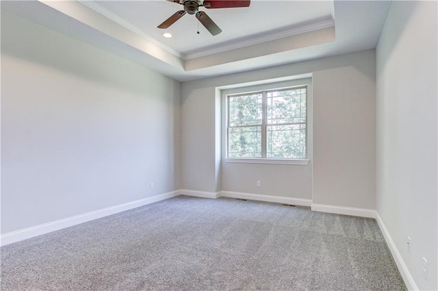 1828 N 92nd Ter, Kansas City, KS 66112 - unfurnished room with a raised ceiling, a ceiling fan, crown molding, baseboards, and carpet flooring