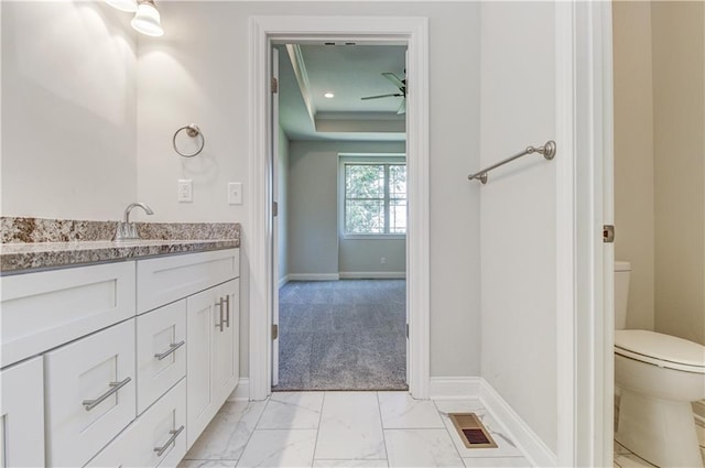 1828 N 92nd Ter, Kansas City, KS 66112 - bathroom featuring vanity, marble finish floor, baseboards, toilet, and visible vents