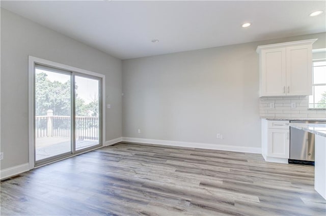 1828 N 92nd Ter, Kansas City, KS 66112 - interior space with recessed lighting, light wood-style floors, visible vents, and baseboards