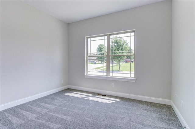 1828 N 92nd Ter, Kansas City, KS 66112 - unfurnished room with baseboards and carpet flooring