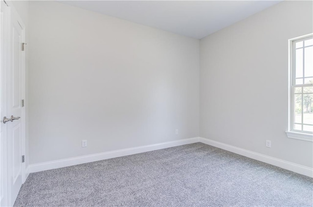 1828 N 92nd Ter, Kansas City, KS 66112 - empty room with baseboards and carpet flooring