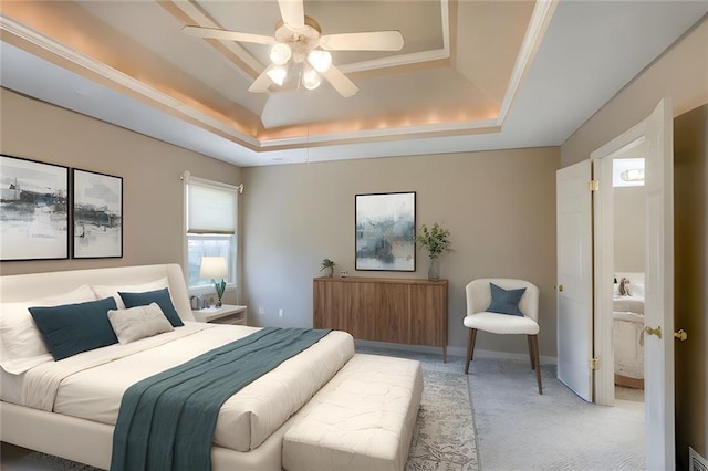bedroom with visible vents, a ceiling fan, a tray ceiling, and light colored carpet
