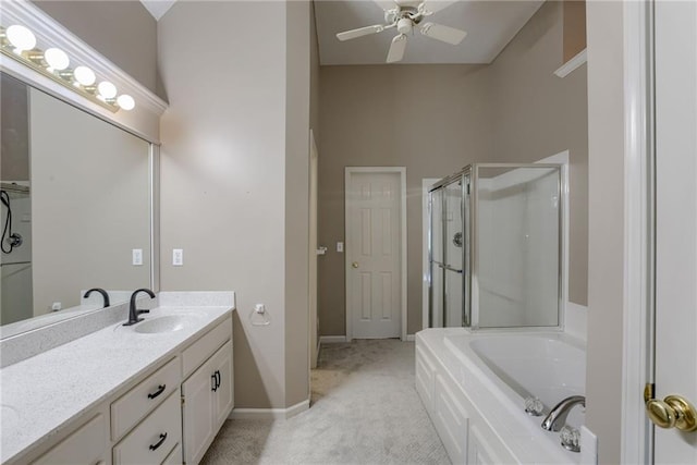 full bathroom featuring a ceiling fan, vanity, baseboards, a garden tub, and a stall shower