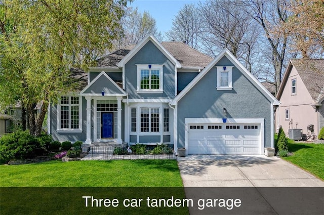 view of front facade with central AC unit, a front lawn, concrete driveway, stucco siding, and a garage
