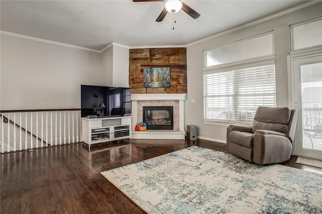 3204 SW Alice Ln, Lees Summit, MO 64082 - living room with crown molding, wood finished floors, a fireplace, baseboards, and ceiling fan