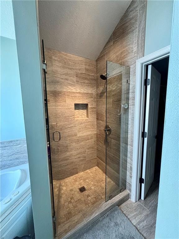 3204 SW Alice Ln, Lees Summit, MO 64082 - bathroom featuring a textured ceiling, a shower stall, and lofted ceiling