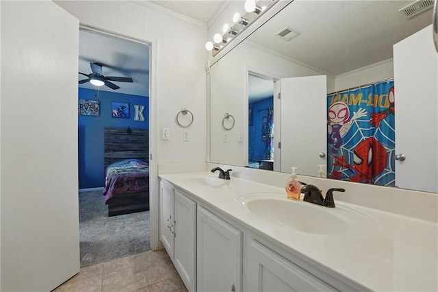 full bath with ornamental molding, double vanity, a ceiling fan, and tile patterned flooring