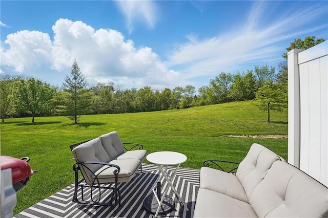 view of green lawn with an outdoor living space