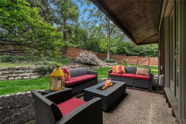 view of patio / terrace featuring a fenced backyard and an outdoor living space with a fire pit
