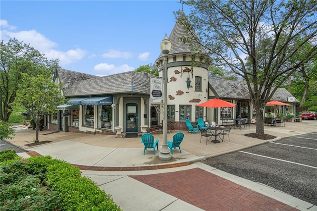 view of community with uncovered parking