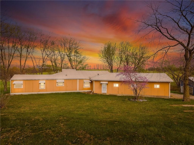 20 SE E Hwy, Trenton, MO 64683 - back of property at dusk featuring a lawn
