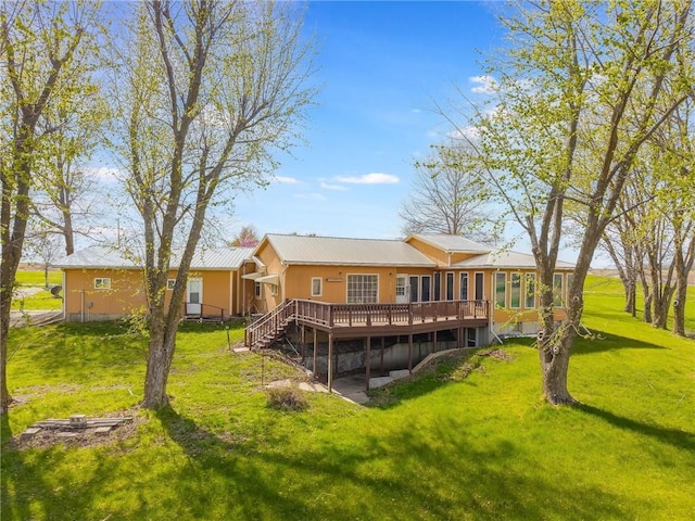 20 SE E Hwy, Trenton, MO 64683 - rear view of house with a wooden deck and a yard