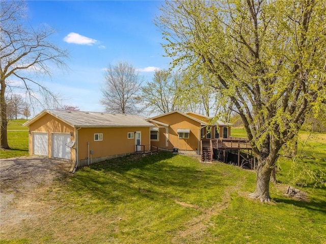 20 SE E Hwy, Trenton, MO 64683 - view of front of house with a deck, a detached garage, and a front yard